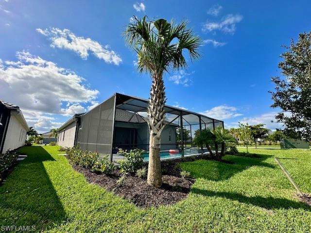 5856 Sunningdale St Avenue Immokalee, FL 34142 - Photo 3 of 44 a front view of a house with garden