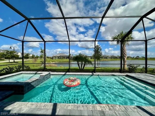 a view of a backyard with sitting area