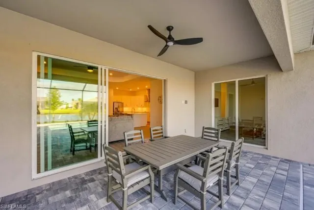 a view of a deck with a table and chairs