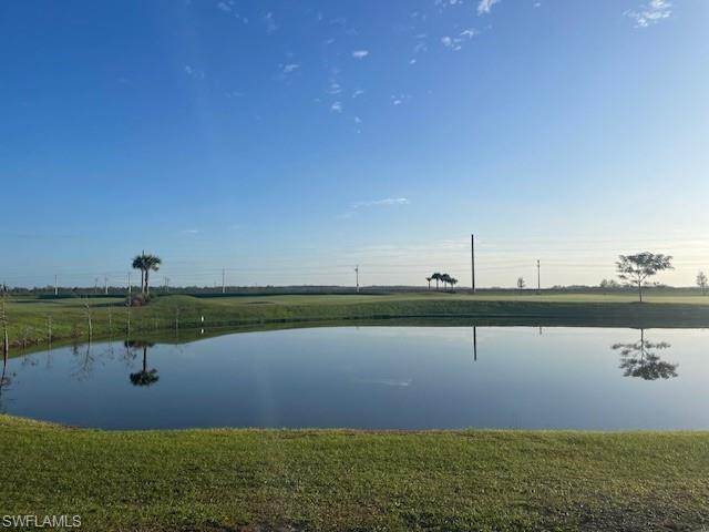5856 Sunningdale St Avenue Immokalee, FL 34142 - Photo 9 of 44 a view of a lake and outdoor space