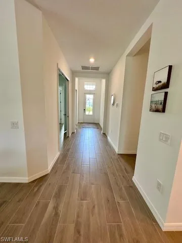wooden floor in a hall with an entryway
