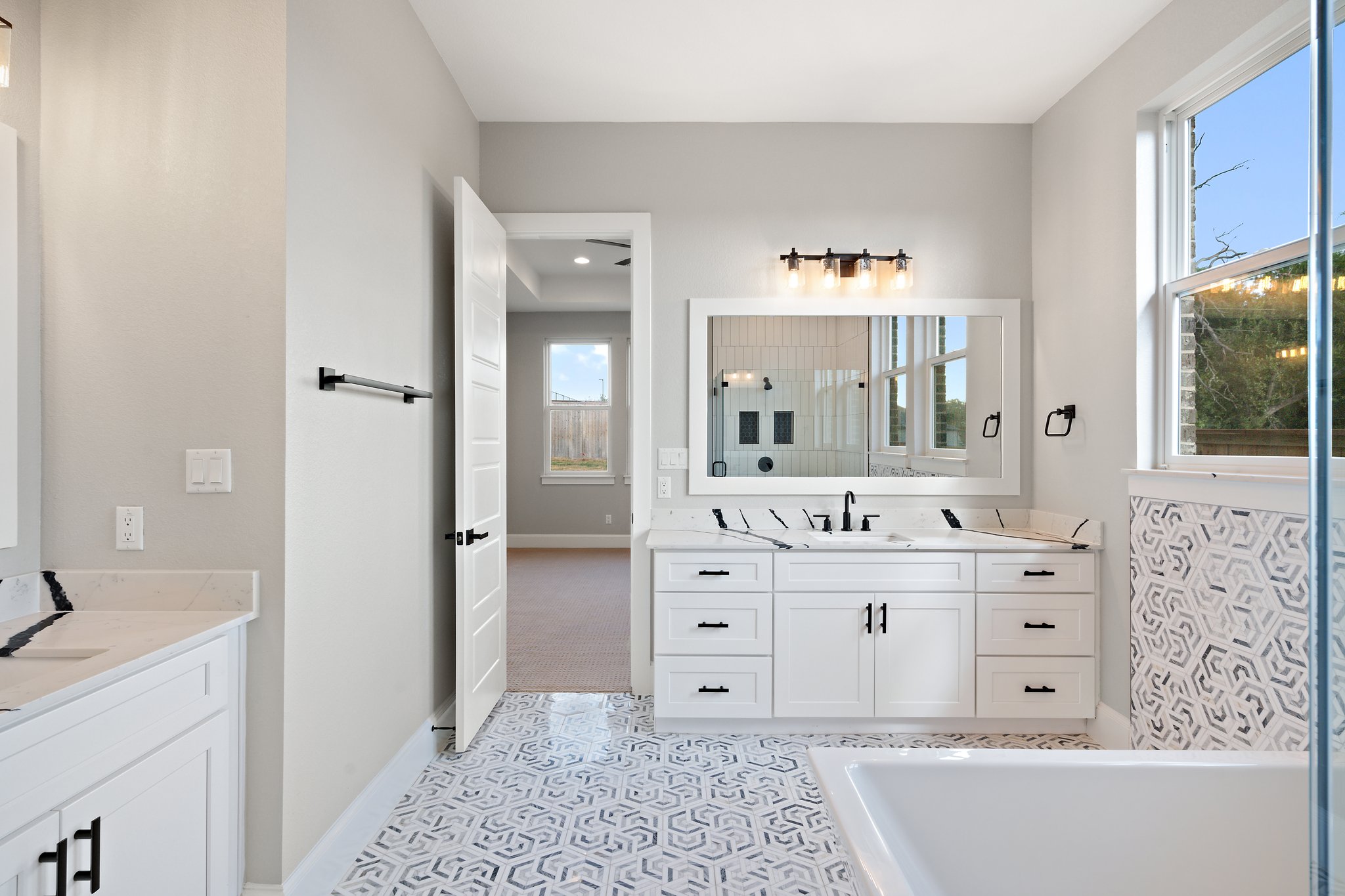 308 Axis Loop Georgetown, TX 78628 - Photo 32 of 40 a bathroom with a double vanity sink mirror and bathtub