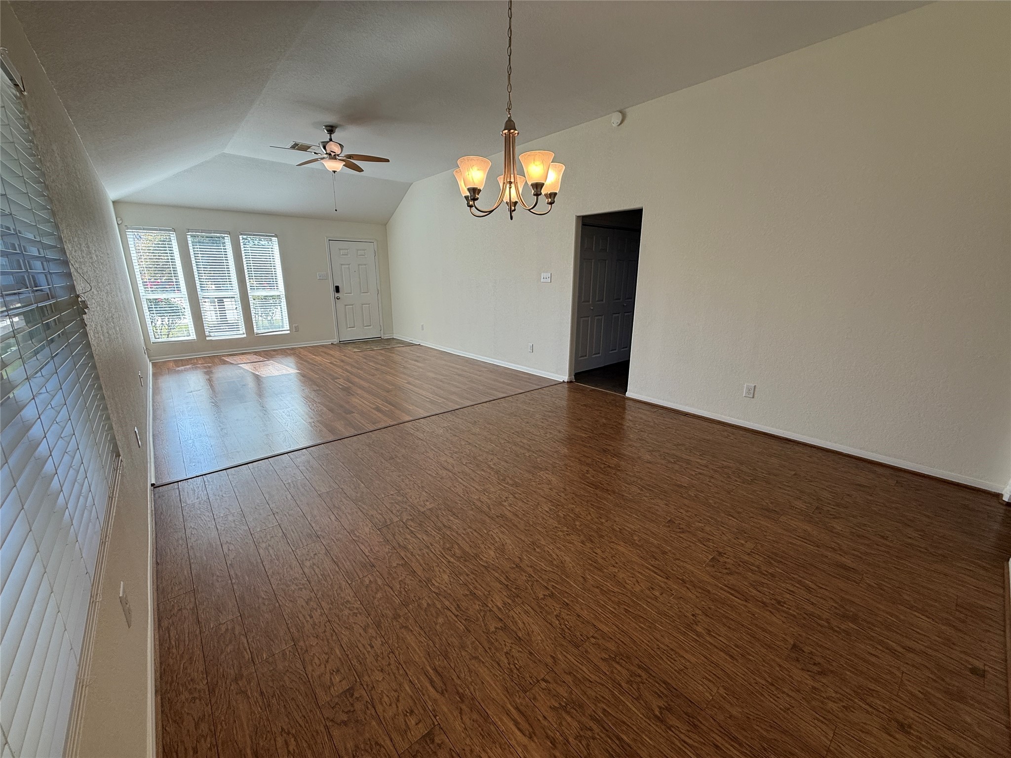 3306 View Valley Trail Katy, TX 77493 - Photo 5 of 19 wooden floor in an empty room with a window