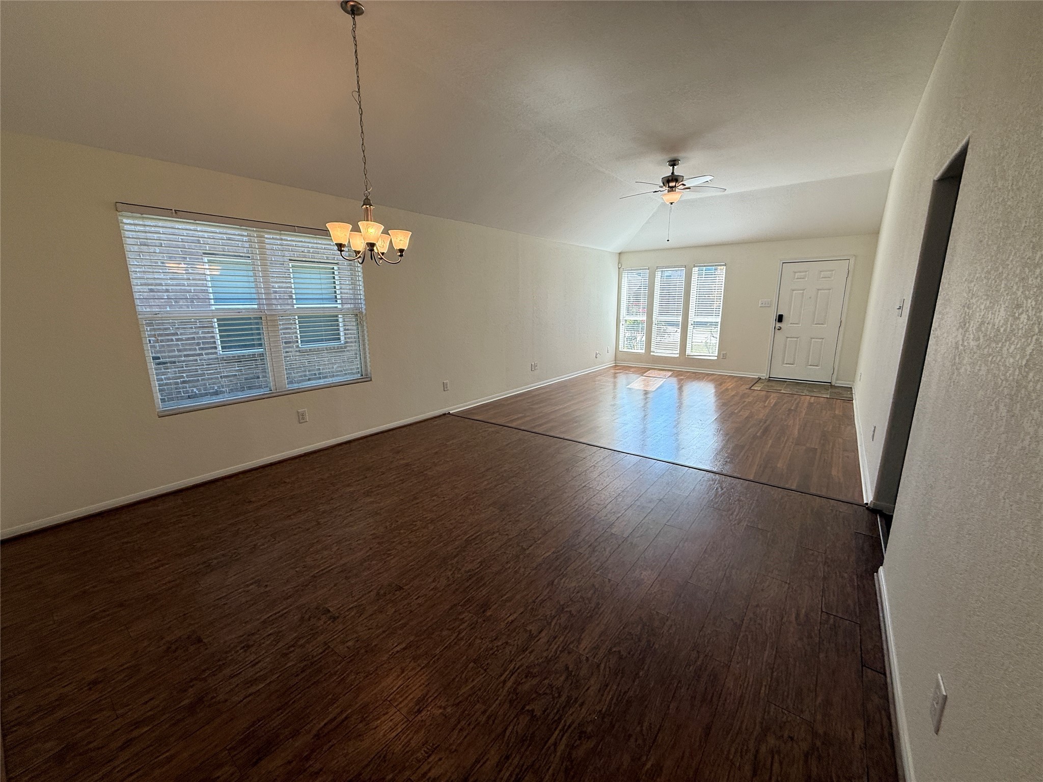 3306 View Valley Trail Katy, TX 77493 - Photo 6 of 19 an empty room with wooden floor and windows