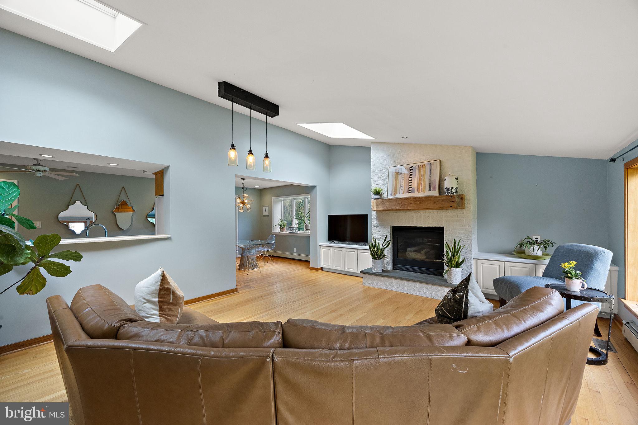 98 Husbands Drive Wilmington, DE 19803 - Photo 11 of 49 a living room with furniture a fireplace and a flat screen tv