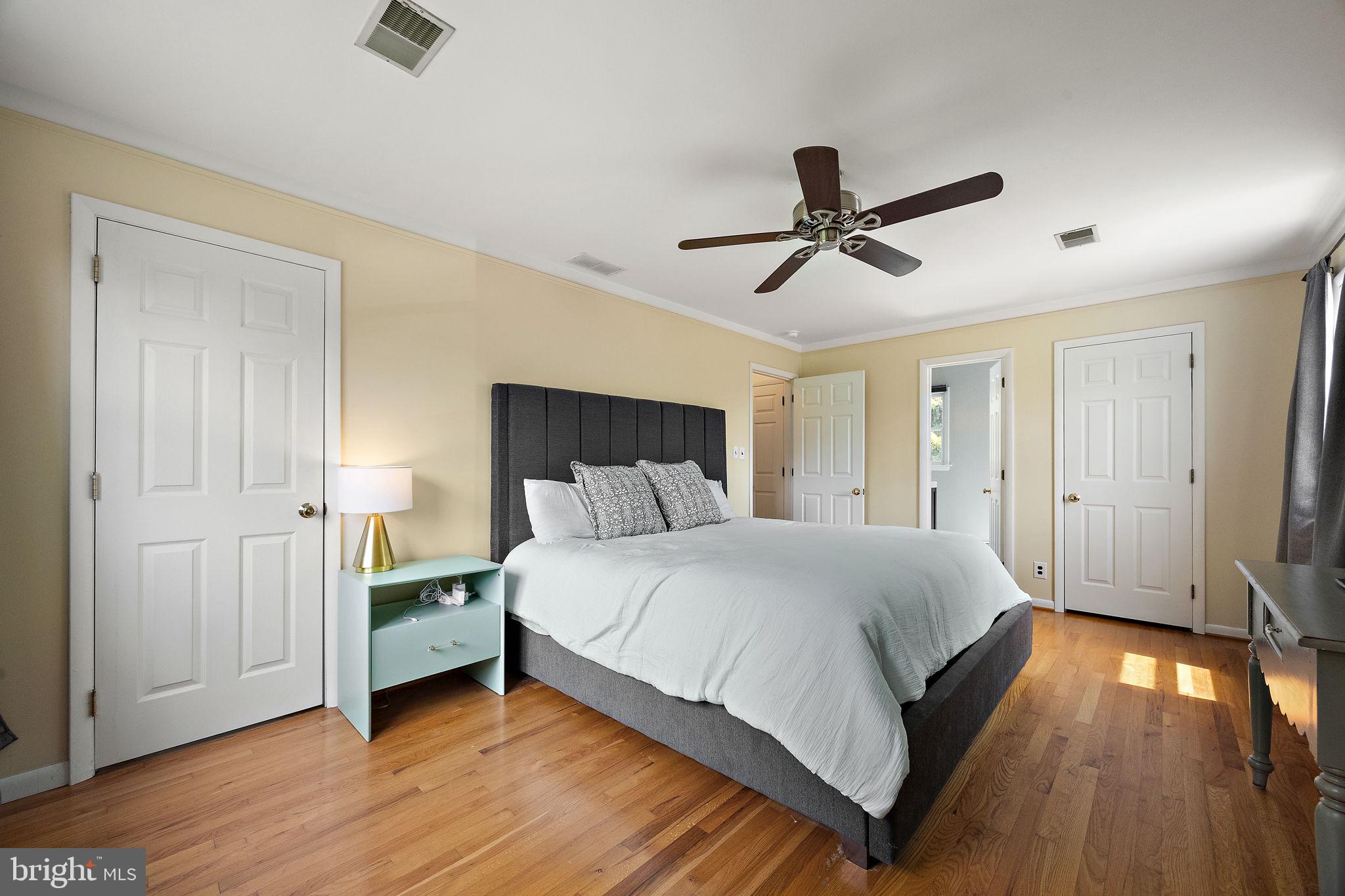 98 Husbands Drive Wilmington, DE 19803 - Photo 21 of 49 a bedroom with a bed and a chandelier