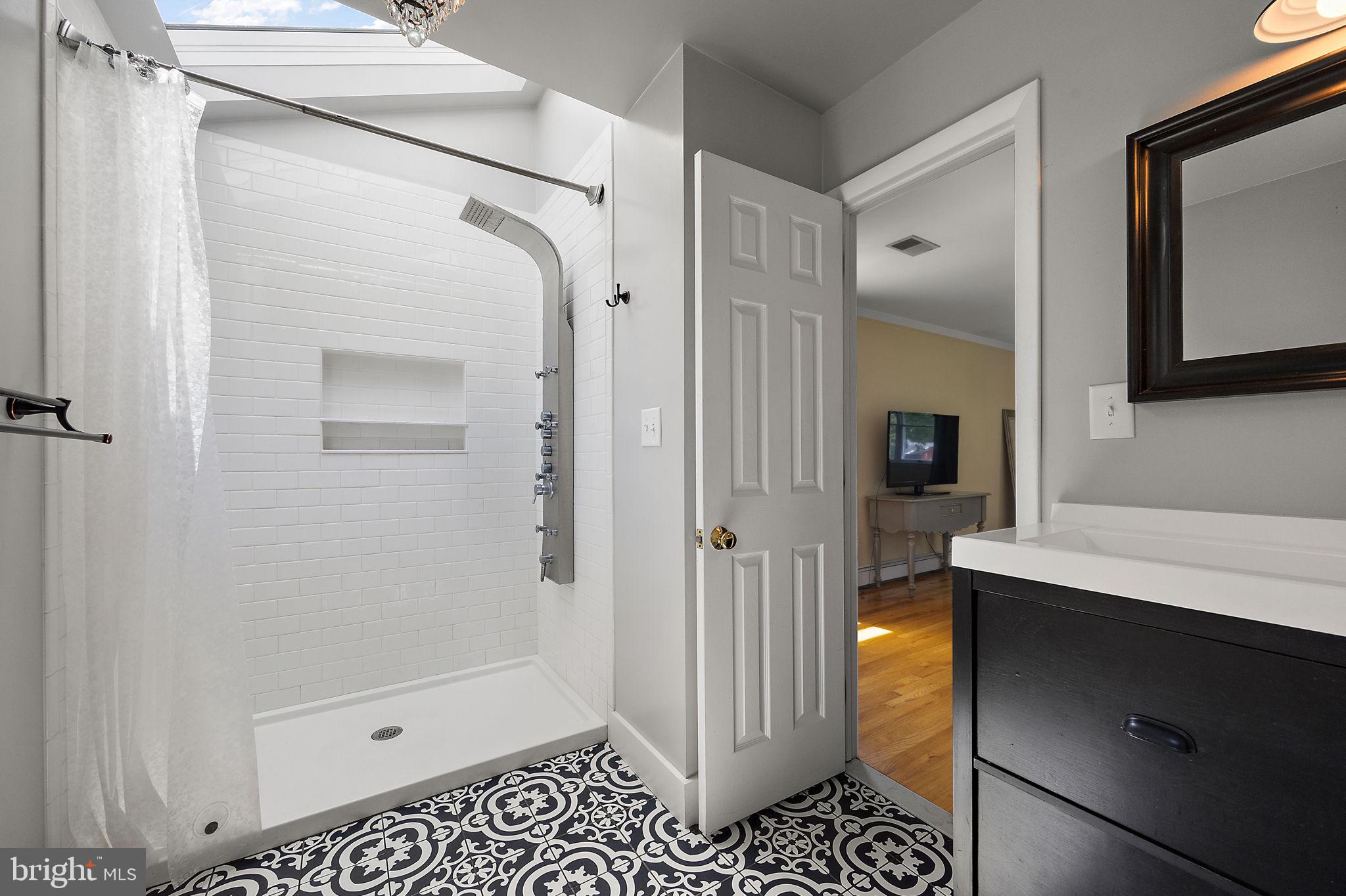 98 Husbands Drive Wilmington, DE 19803 - Photo 22 of 49 a bathroom with a shower and a sink