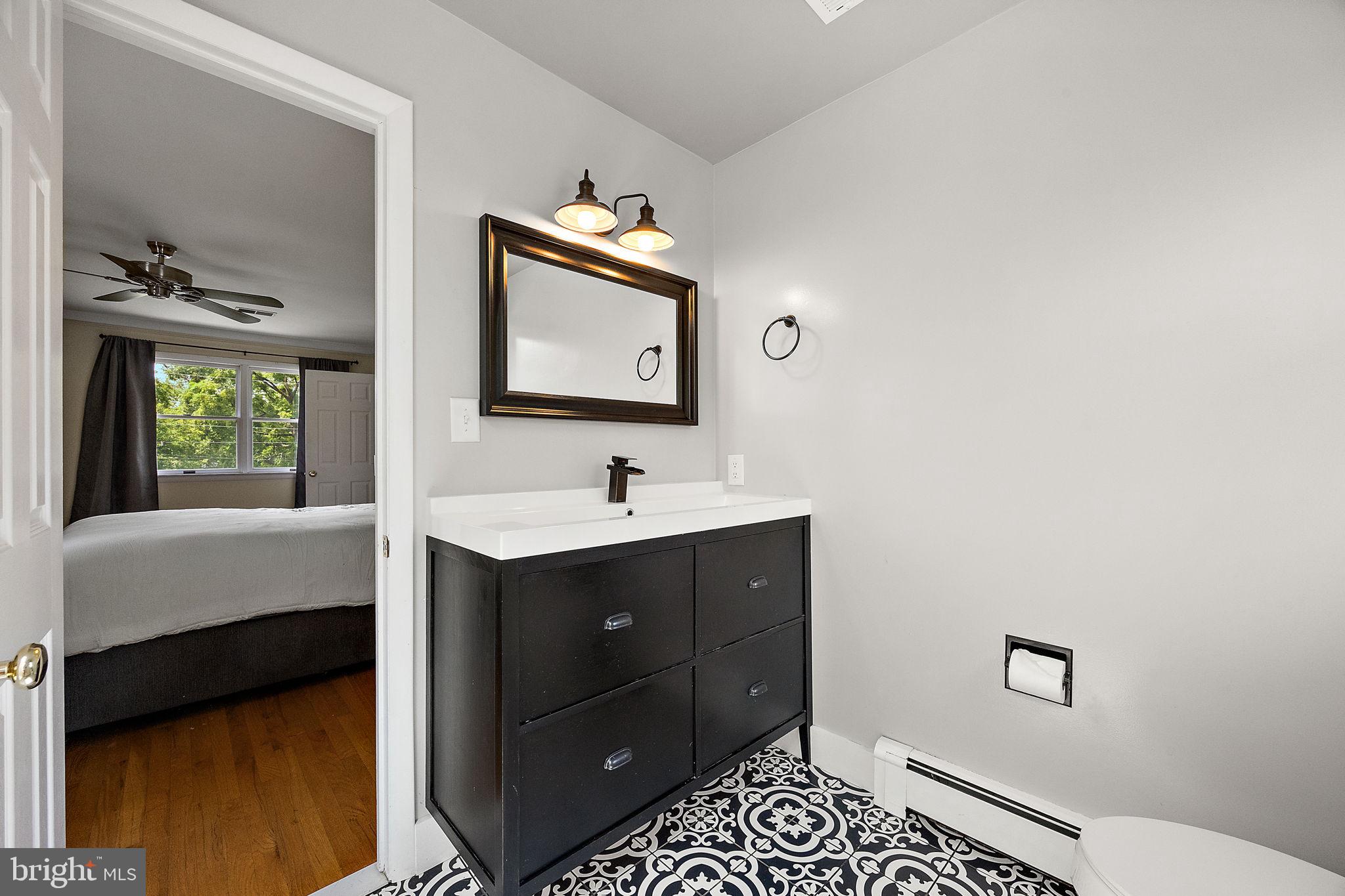 98 Husbands Drive Wilmington, DE 19803 - Photo 23 of 49 a bathroom with a sink and a mirror