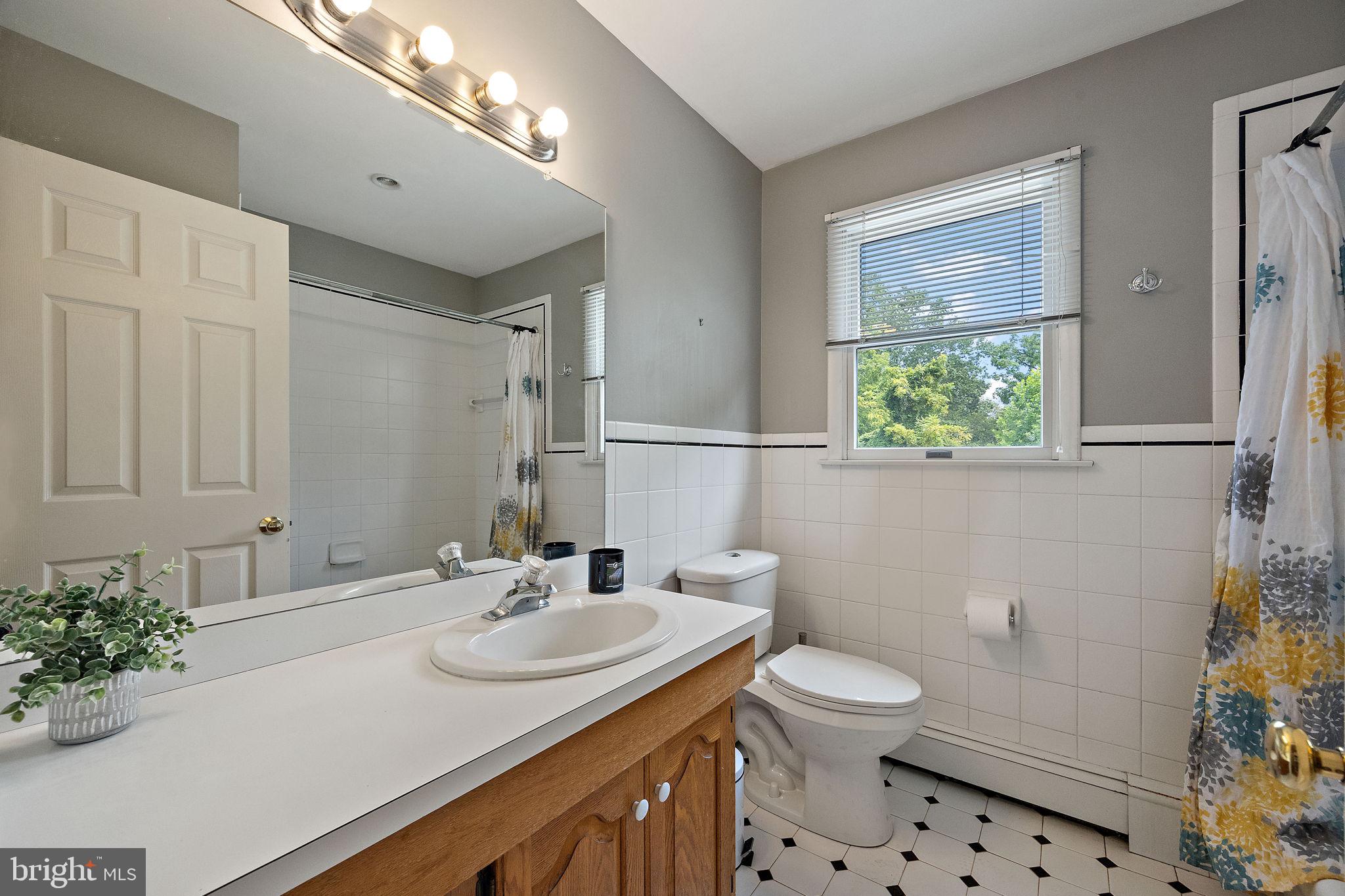 98 Husbands Drive Wilmington, DE 19803 - Photo 27 of 49 a bathroom with a sink toilet and shower