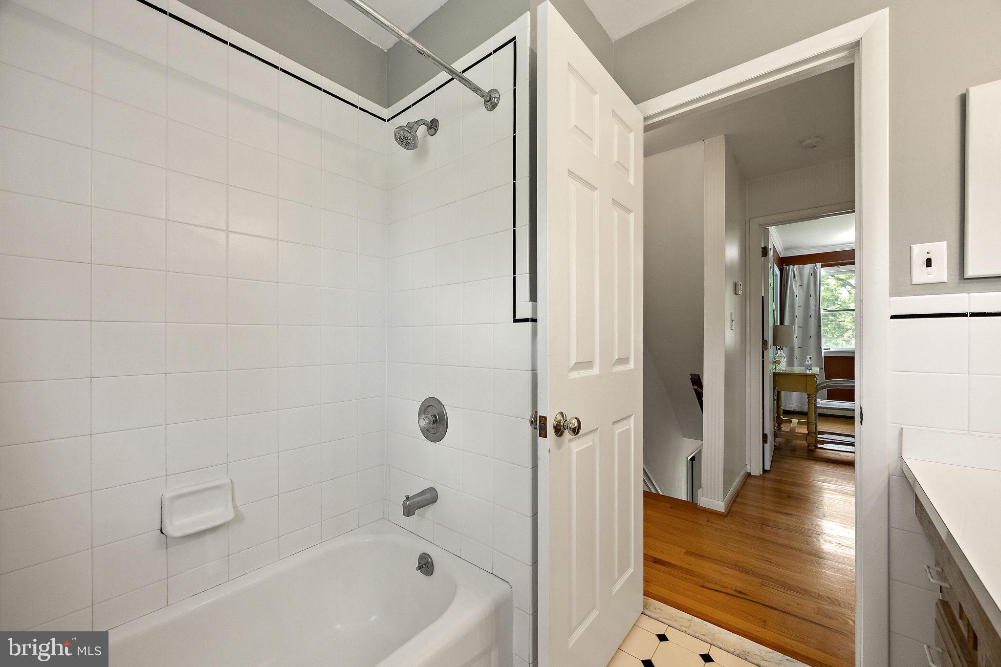 98 Husbands Drive Wilmington, DE 19803 - Photo 28 of 49 a bathroom with a tub shower vanity and a sink