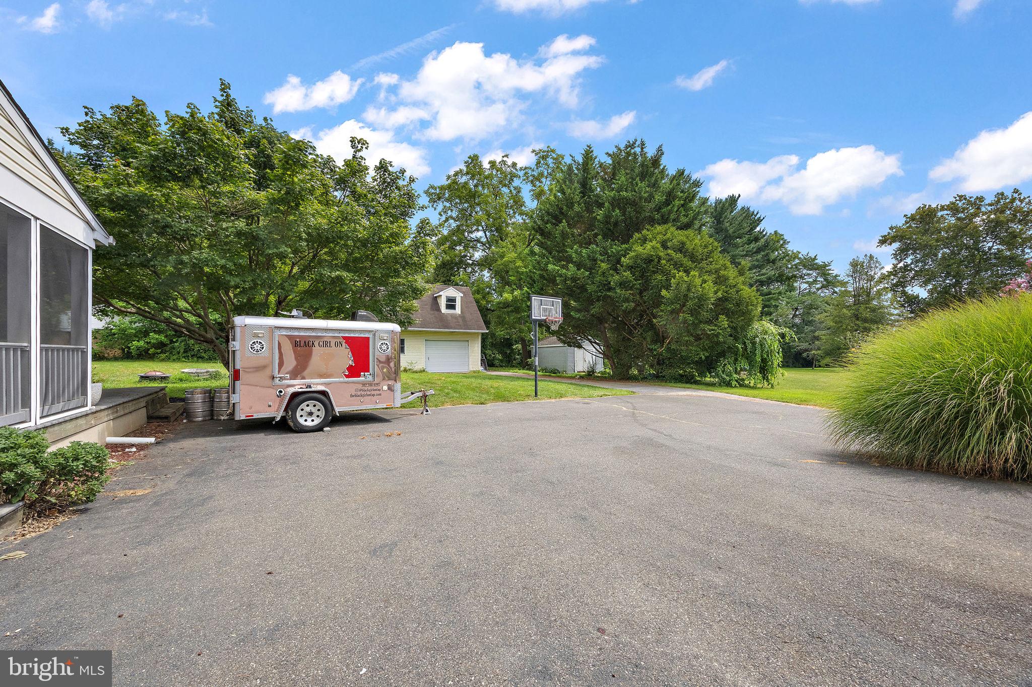 98 Husbands Drive Wilmington, DE 19803 - Photo 38 of 49 a view of a house with a yard and parking space