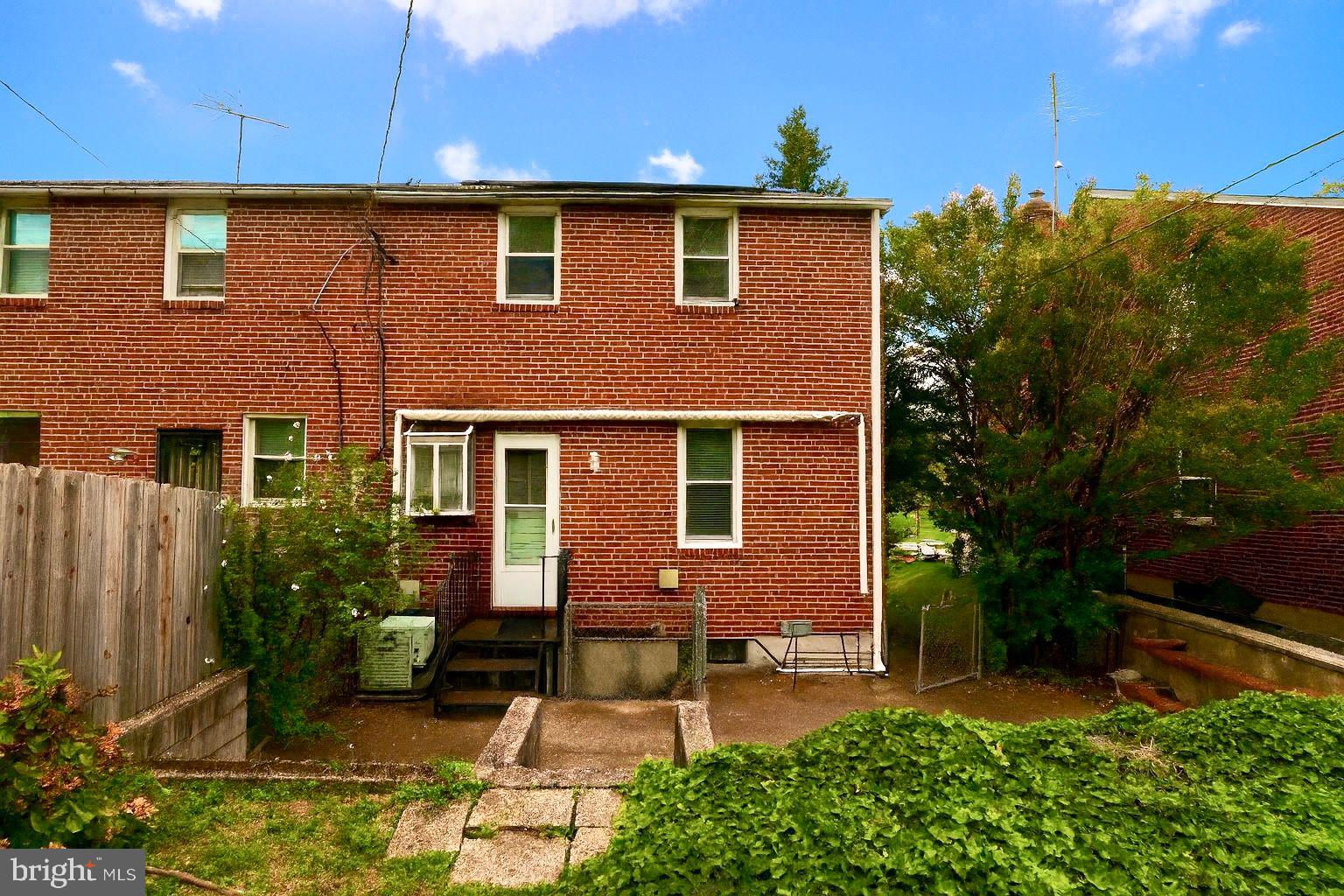 2107 Echodale Avenue Baltimore, MD 21214 - Photo 2 of 2 a front view of a house with garden