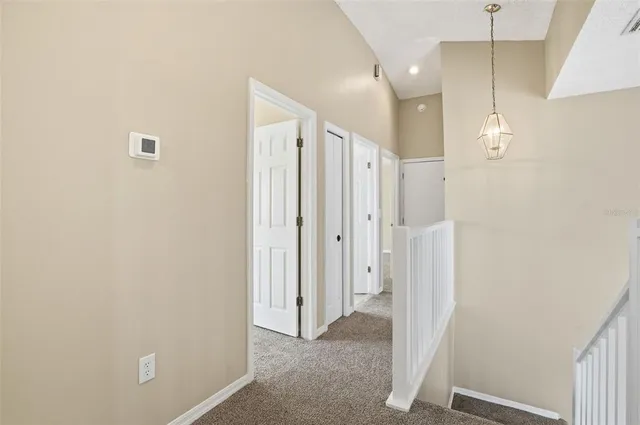 a bathroom with a shower and a glass door