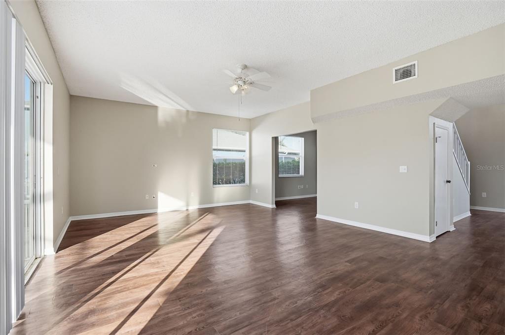 13032 St Filagree Drive Riverview, FL 33579 - Photo 16 of 44 an empty room with wooden floor and windows
