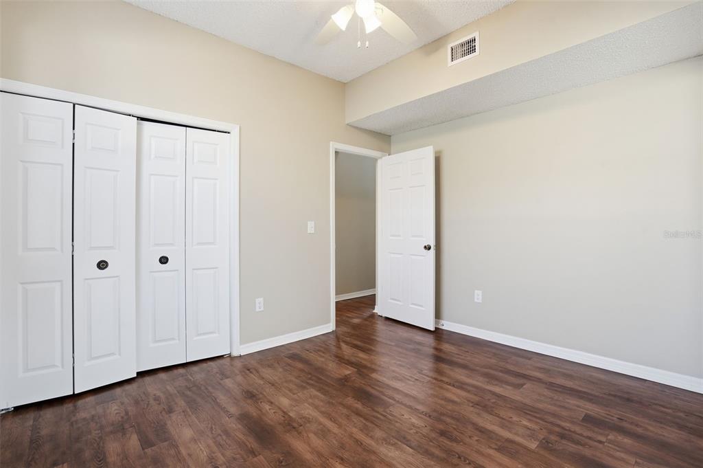 13032 St Filagree Drive Riverview, FL 33579 - Photo 22 of 44 a view of an empty room with wooden floor