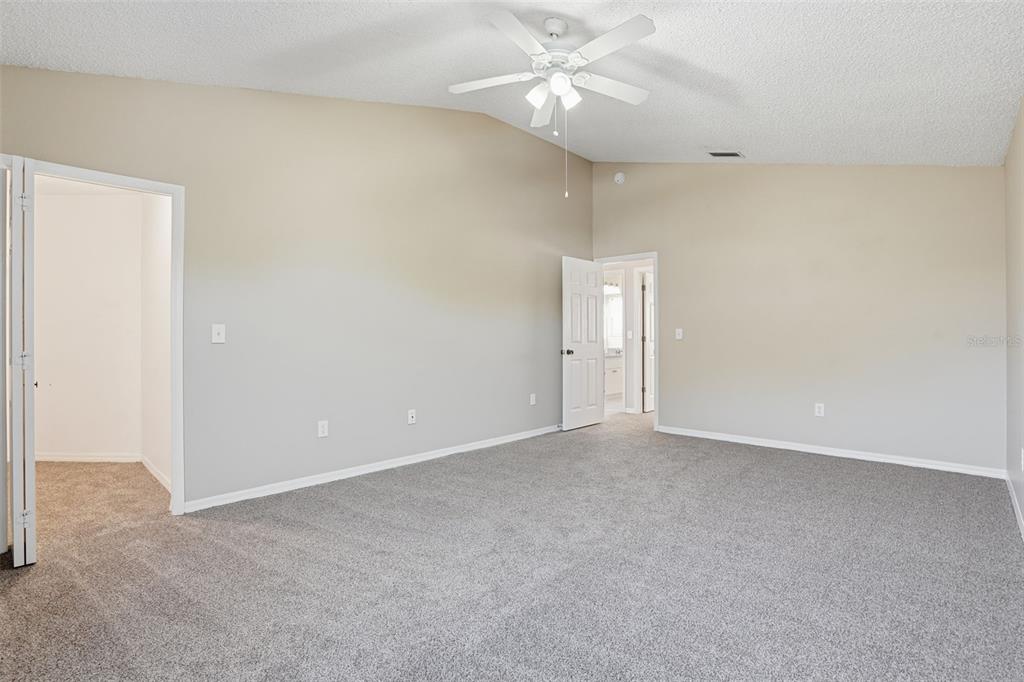 13032 St Filagree Drive Riverview, FL 33579 - Photo 28 of 44 an empty room with a ceiling fan and a window