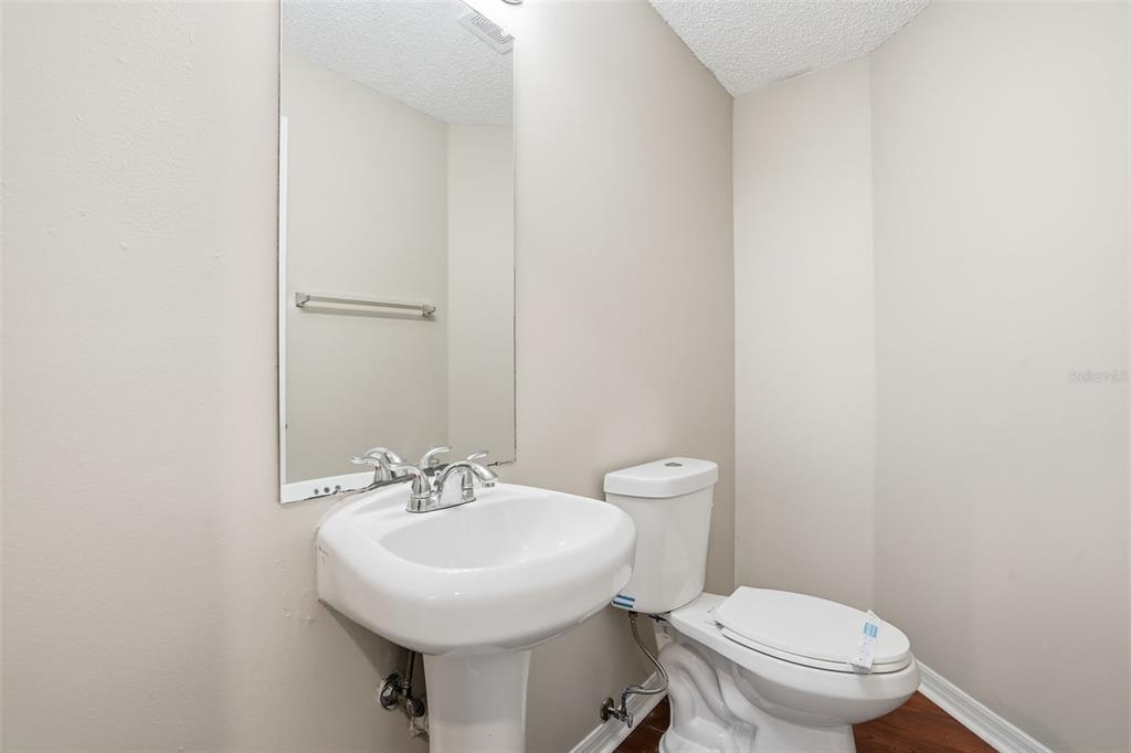 13032 St Filagree Drive Riverview, FL 33579 - Photo 30 of 44 a bathroom with a sink a toilet and a mirror