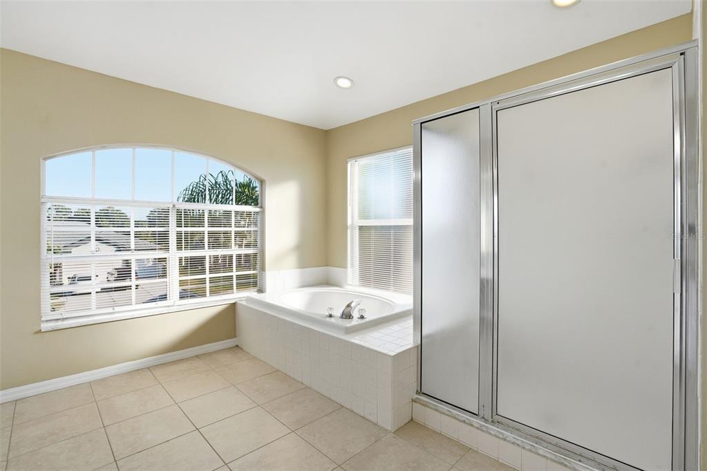 13032 St Filagree Drive Riverview, FL 33579 - Photo 33 of 44 a bathroom with a tub shower and sink