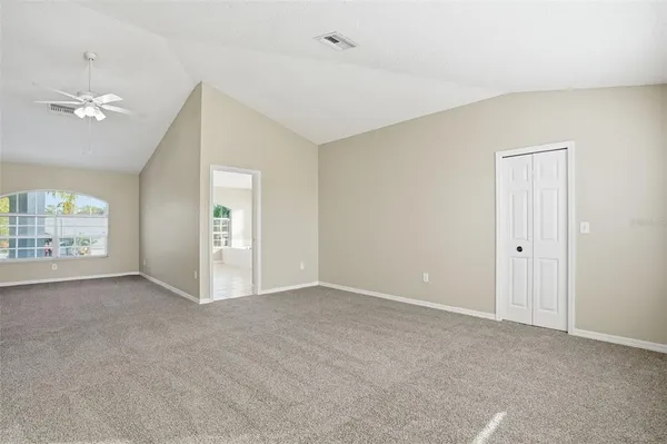 a view of an empty room with a window
