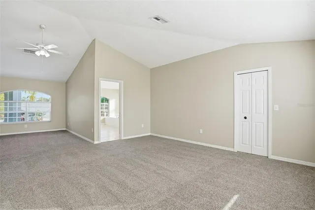 a view of an empty room with a window