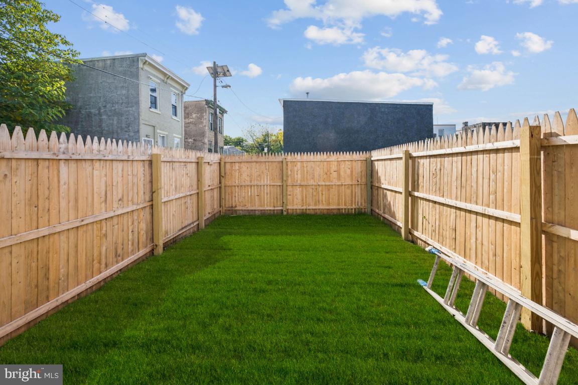 718 Spruce Street Camden, NJ 08103 - Photo 12 of 39 a view of a backyard with wooden fence