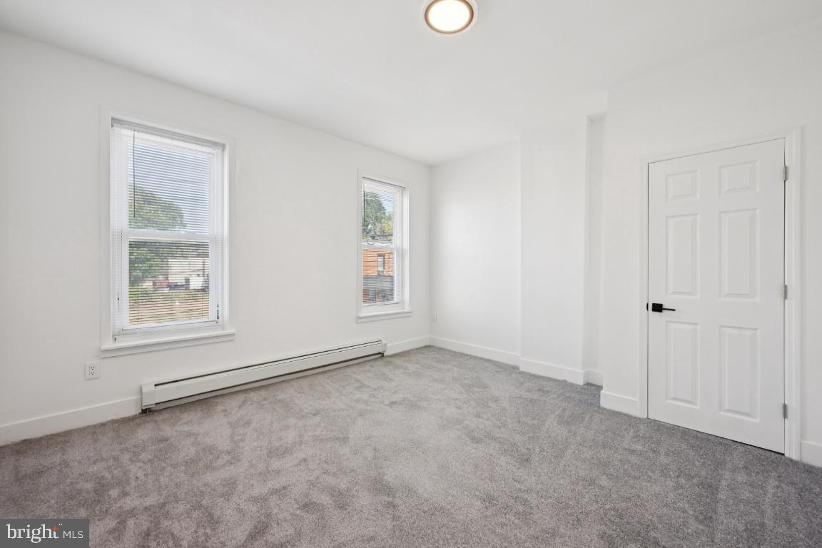 718 Spruce Street Camden, NJ 08103 - Photo 14 of 39 an empty room with windows