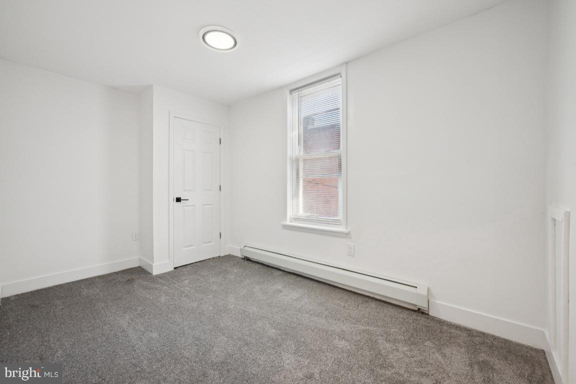 718 Spruce Street Camden, NJ 08103 - Photo 15 of 39 an empty room with windows