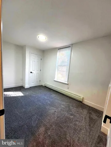 an empty room with a empty space and a window