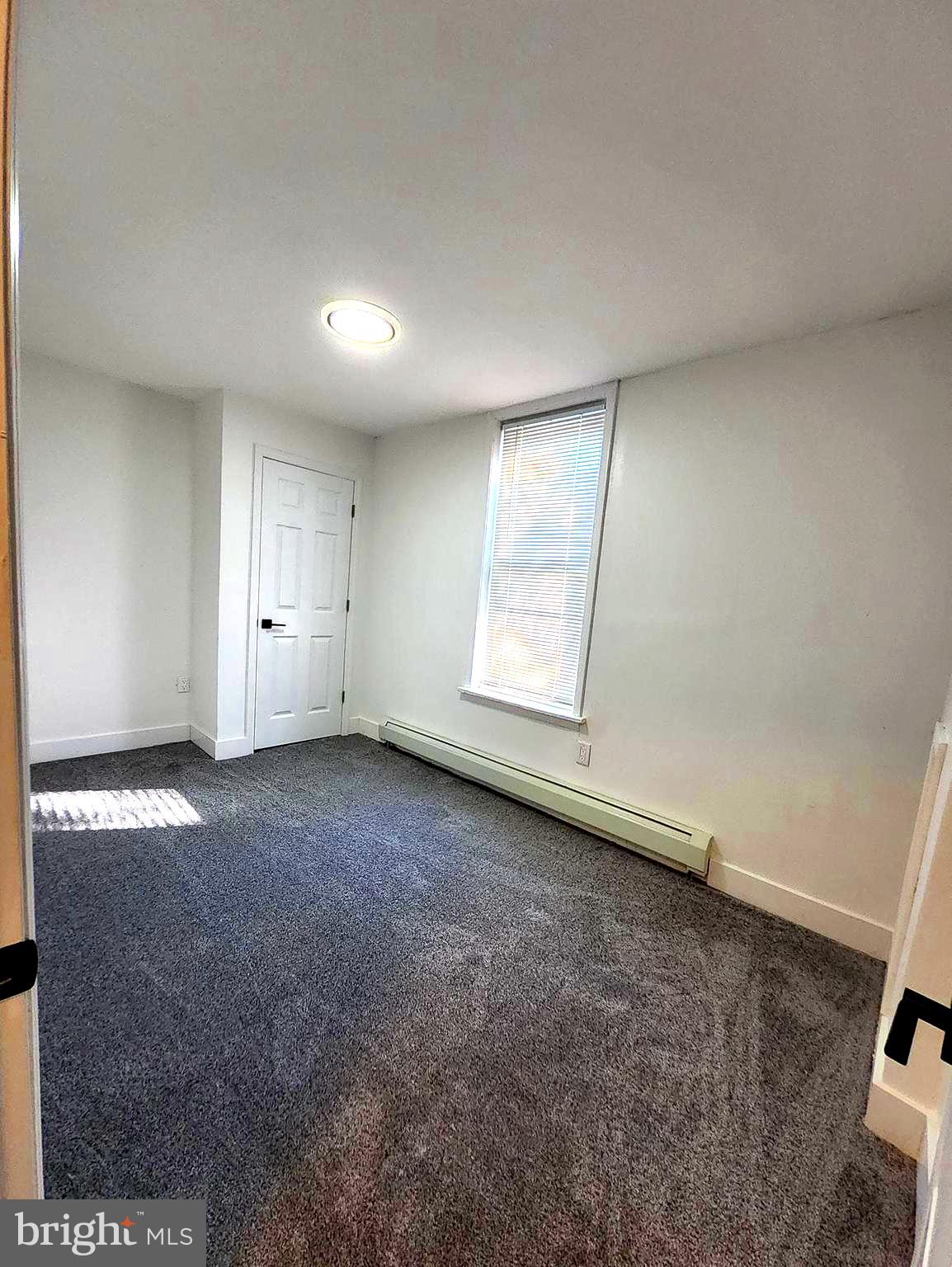 718 Spruce Street Camden, NJ 08103 - Photo 16 of 39 an empty room with a empty space and a window