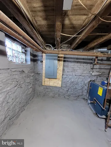 a view of an empty room with wooden walls