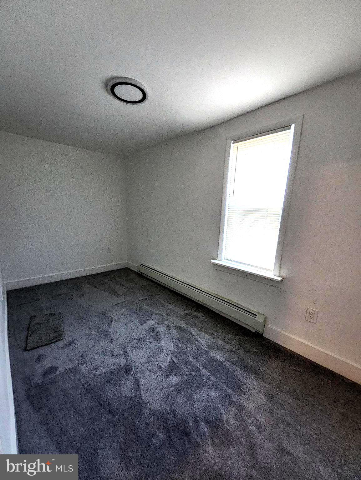 718 Spruce Street Camden, NJ 08103 - Photo 27 of 39 an empty room with a window