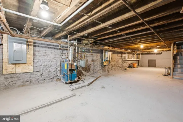 a view of front door of house with stairs