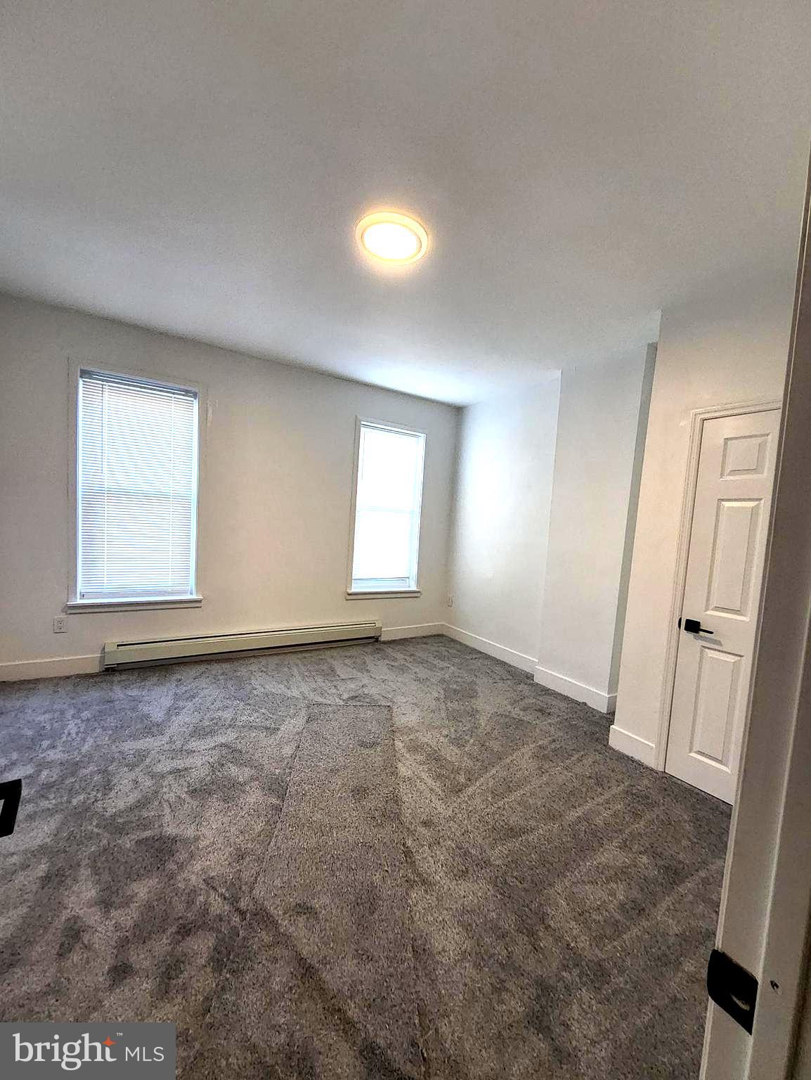 718 Spruce Street Camden, NJ 08103 - Photo 35 of 39 an empty room with windows and closet