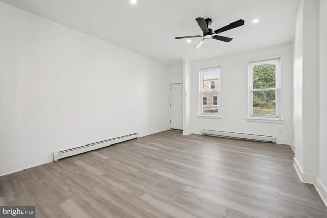 a kitchen with sink a microwave and cabinets