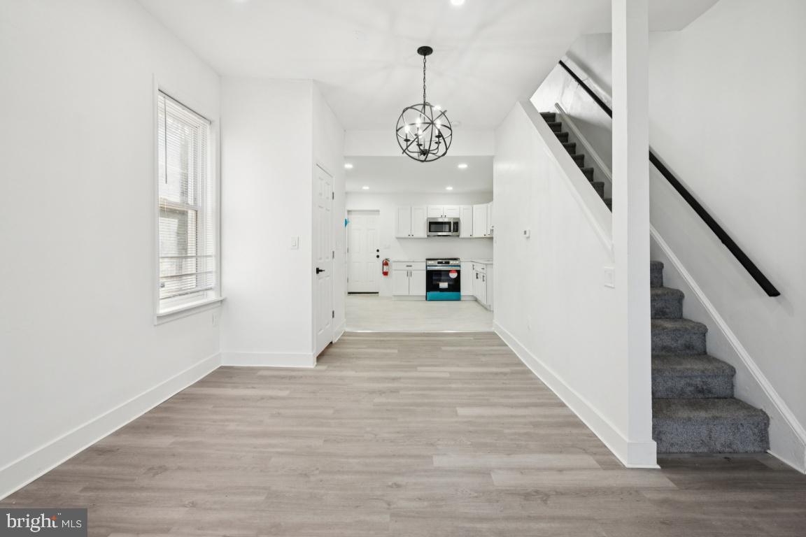 718 Spruce Street Camden, NJ 08103 - Photo 5 of 39 a view of an entryway with wooden floor