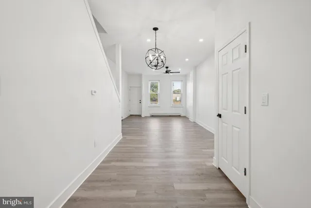 a view of an entryway with wooden floor
