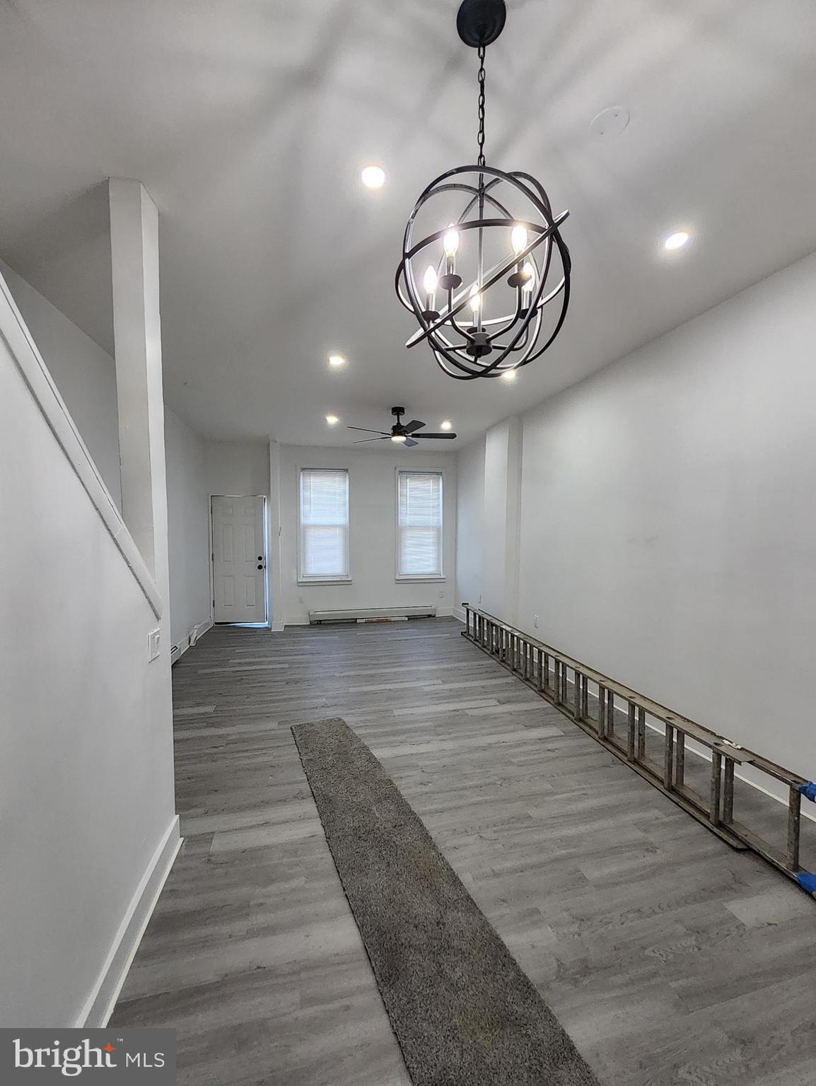 718 Spruce Street Camden, NJ 08103 - Photo 9 of 39 a view of a hallway with wooden floor