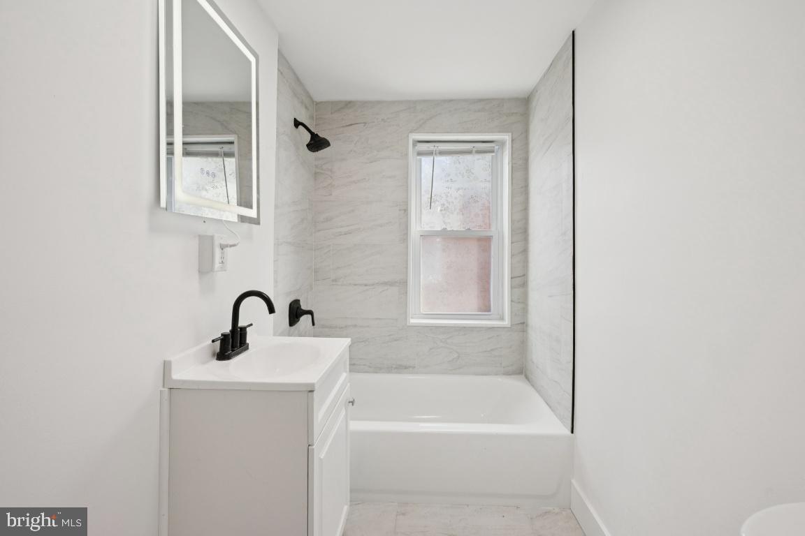 718 Spruce Street Camden, NJ 08103 - Photo 10 of 39 a bathroom with a bathtub and a sink