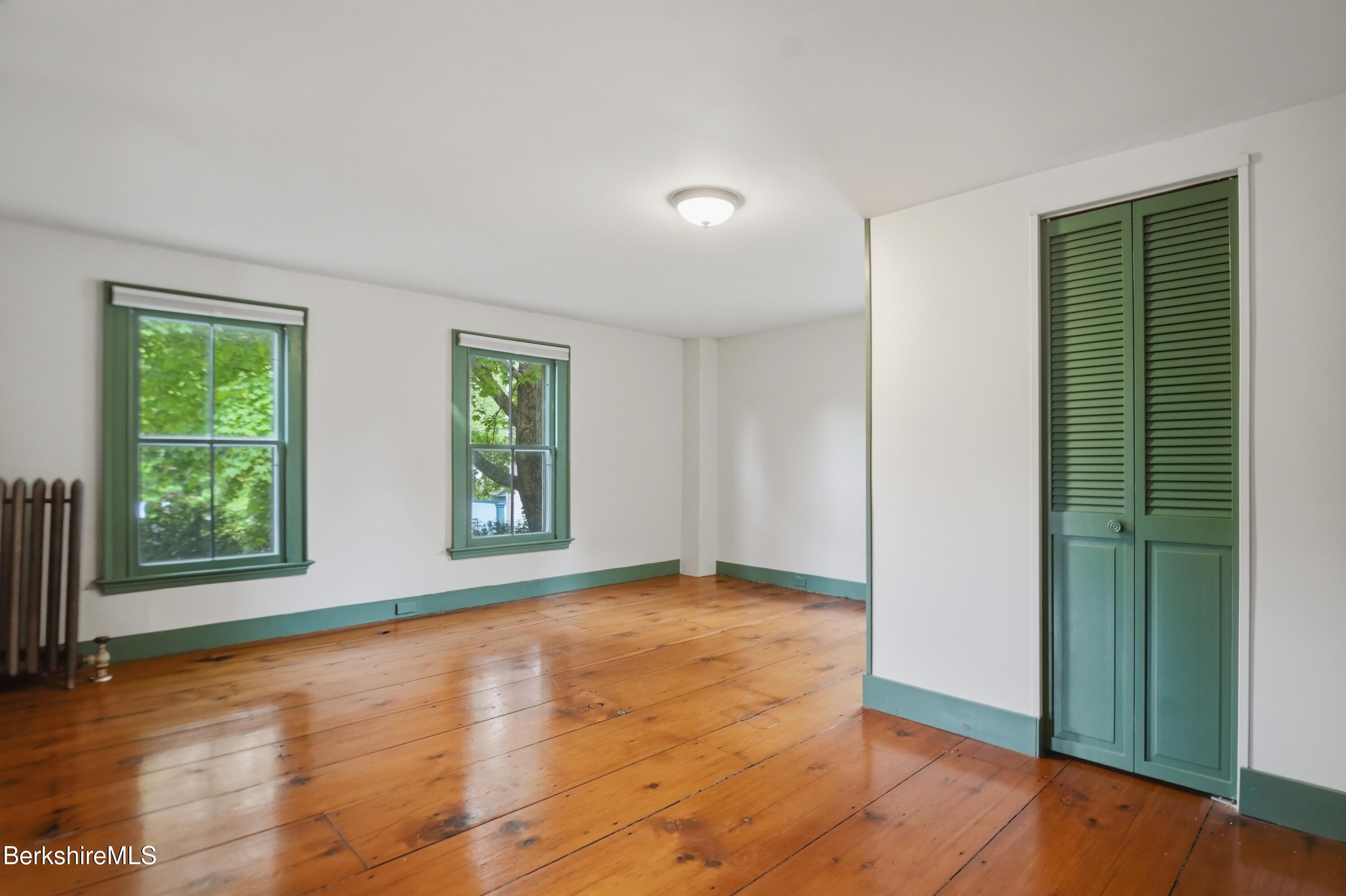 4 Stockbridge Road West Stockbridge, MA 01266 - Photo 51 of 94 a view of an empty room with wooden floor and a window
