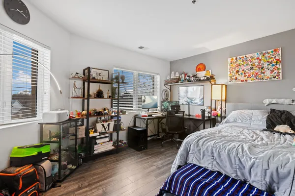 a bedroom with bed and a window