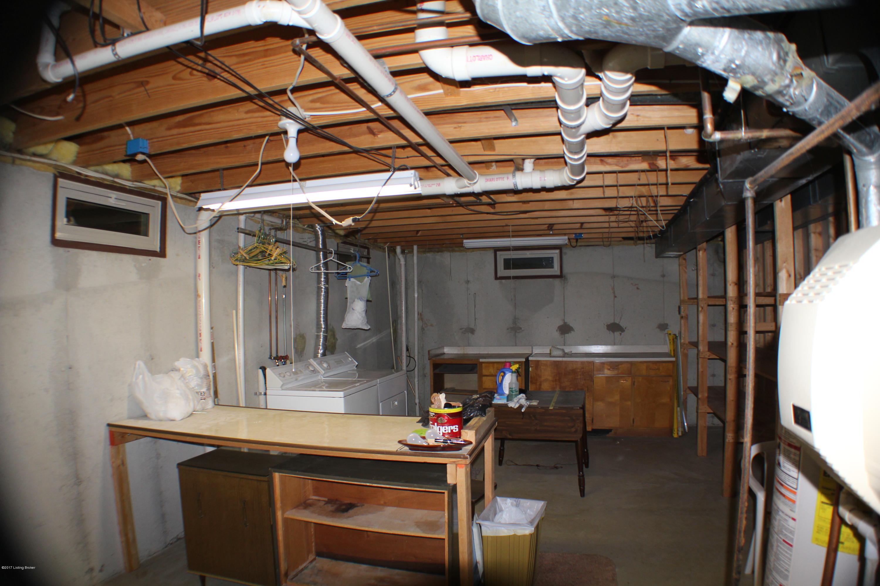 6011 Stone Bluff Road Louisville, KY 40291 - Photo 51 of 54 r Laundry Room with shelves and folding