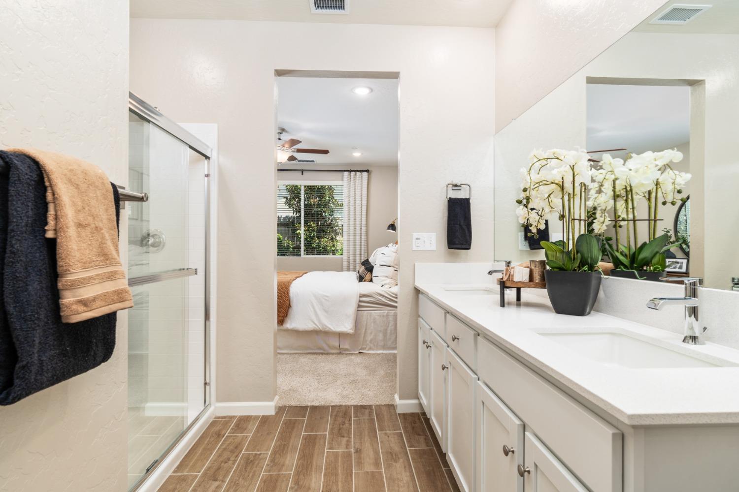 1150 Encore Way West Madera, CA 93636 - Photo 27 of 33 a bathroom with a double vanity sink and mirror
