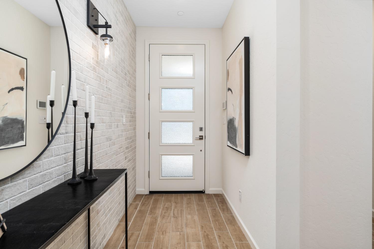 1150 Encore Way West Madera, CA 93636 - Photo 6 of 33 a view of a bathroom from a hallway