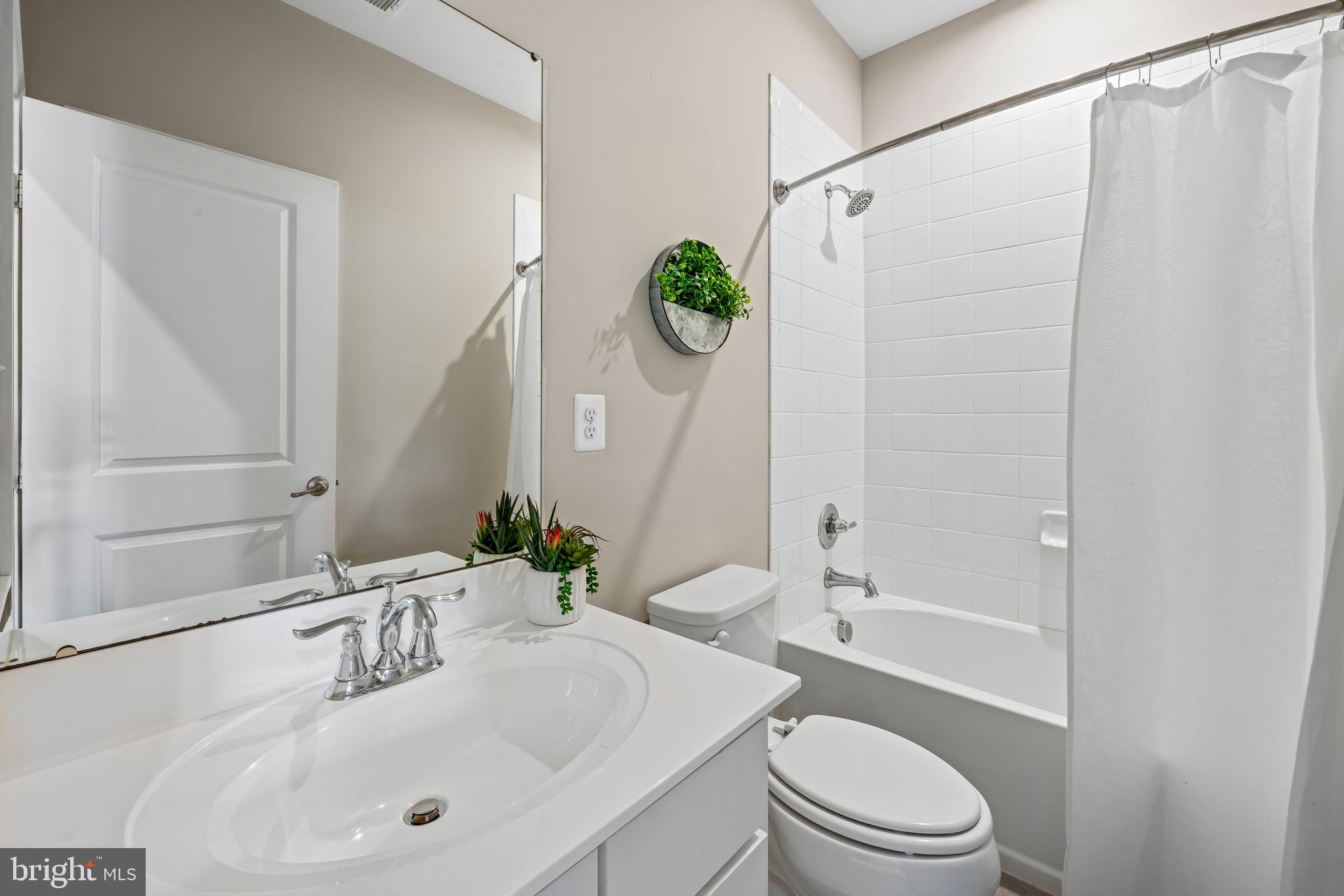 8206 Kirk Farm Circle Windsor Mill, MD 21244 - Photo 14 of 35 a bathroom with a sink a toilet and shower