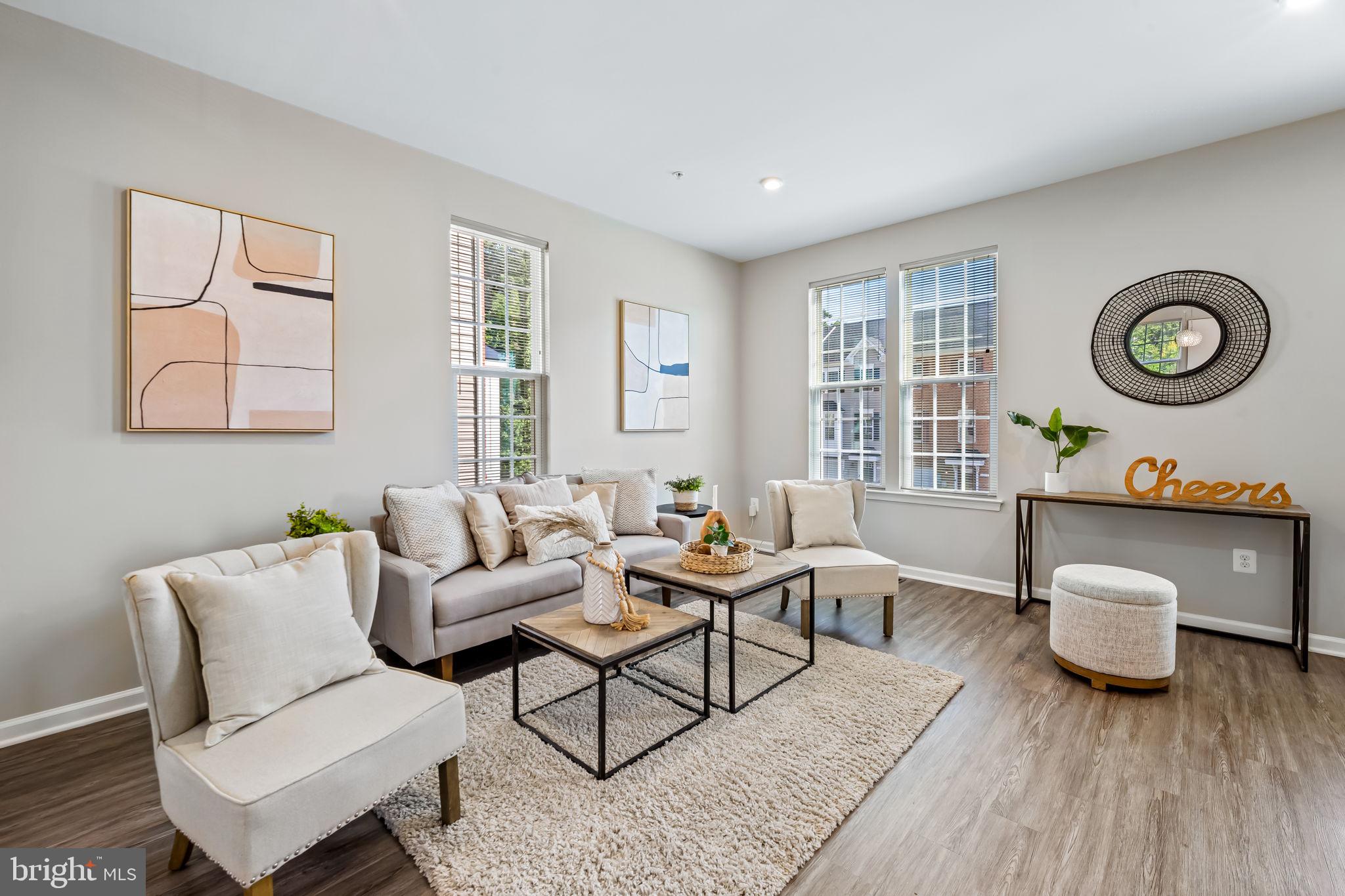 8206 Kirk Farm Circle Windsor Mill, MD 21244 - Photo 2 of 35 a living room with furniture and a wooden floor