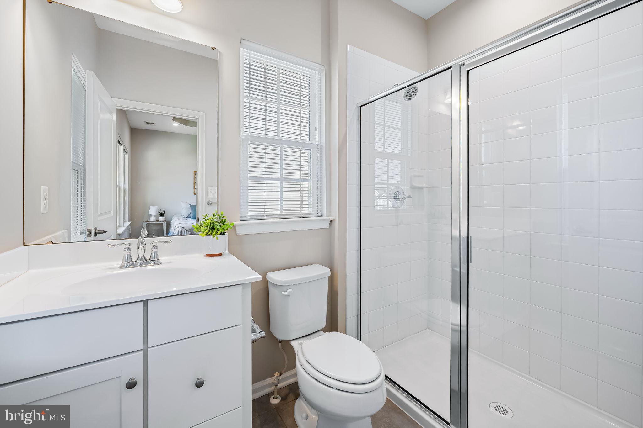 8206 Kirk Farm Circle Windsor Mill, MD 21244 - Photo 26 of 35 a bathroom with a sink toilet vanity and shower