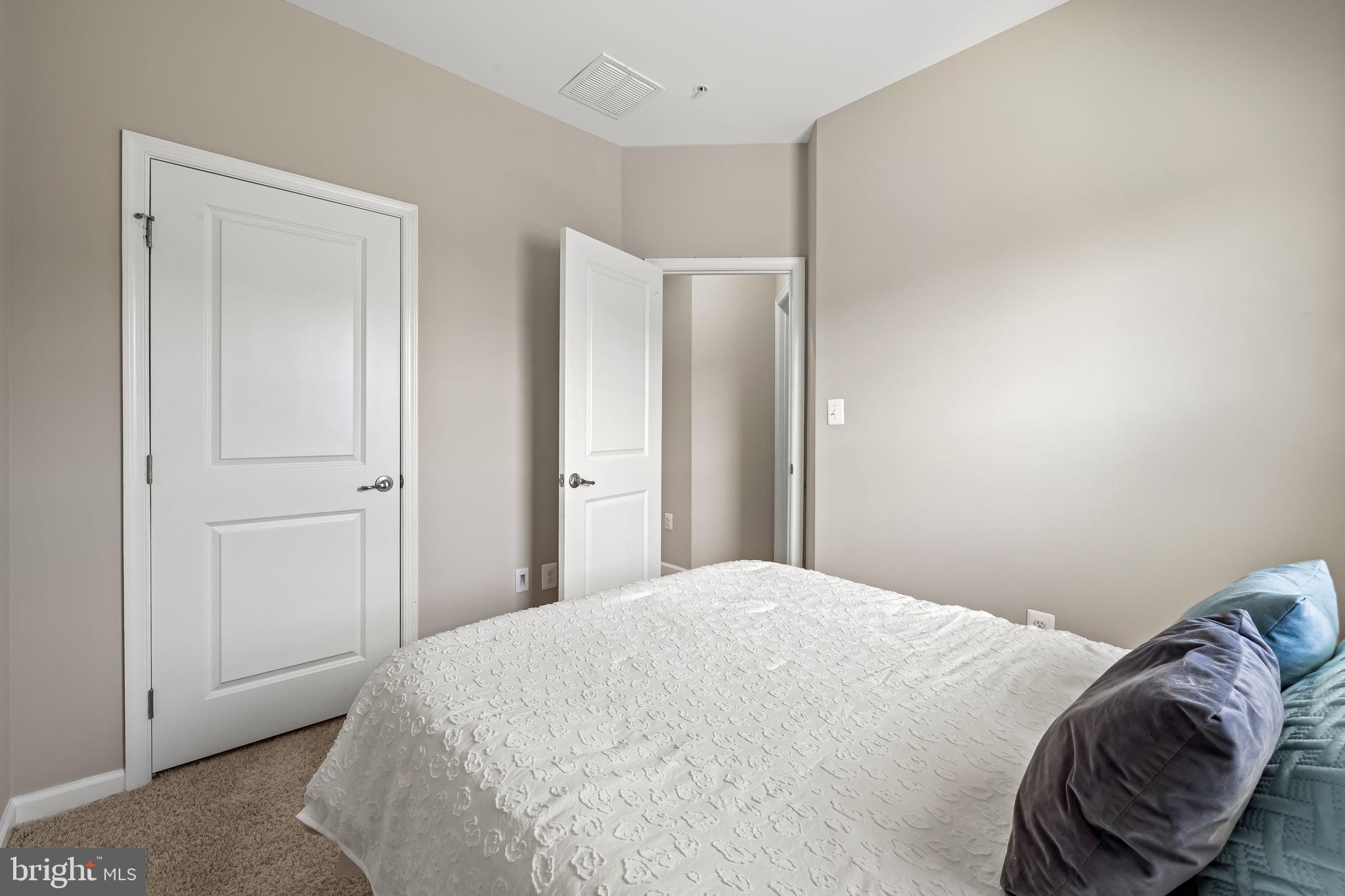 8206 Kirk Farm Circle Windsor Mill, MD 21244 - Photo 28 of 35 a bedroom with a bed and a mirror