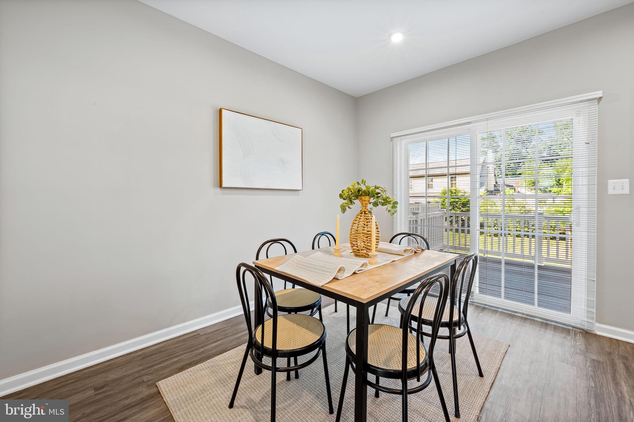 8206 Kirk Farm Circle Windsor Mill, MD 21244 - Photo 5 of 35 a view of a dining room with furniture and wooden floor