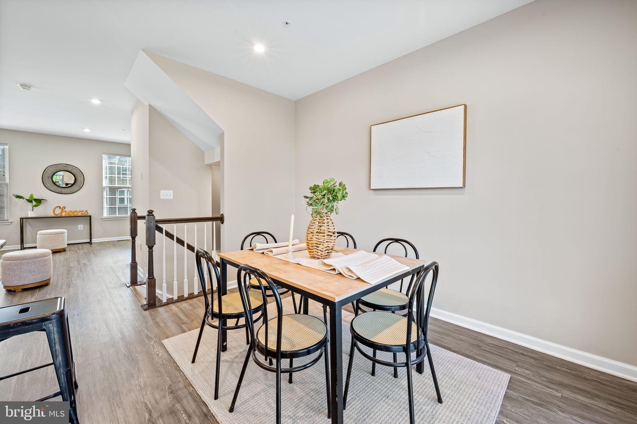8206 Kirk Farm Circle Windsor Mill, MD 21244 - Photo 7 of 35 a view of a dining room with furniture and wooden floor
