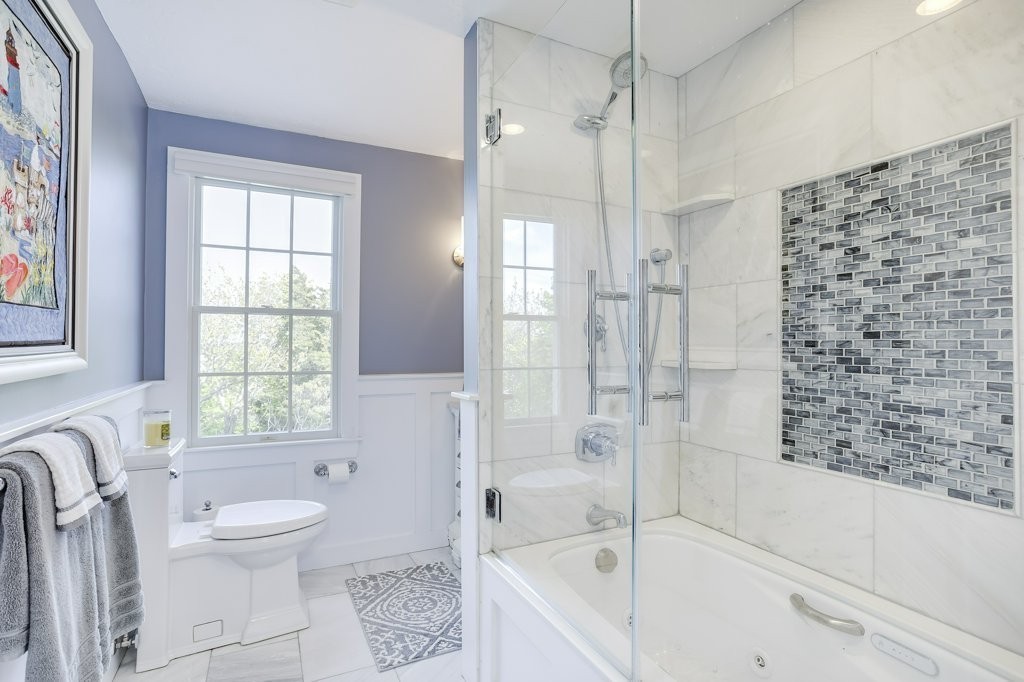 18 Spring Valley Road Hull, MA 02045 - Photo 21 of 30 a bathroom with a bathtub toilet and shower